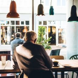 Man sitting alone in a coffee shop.