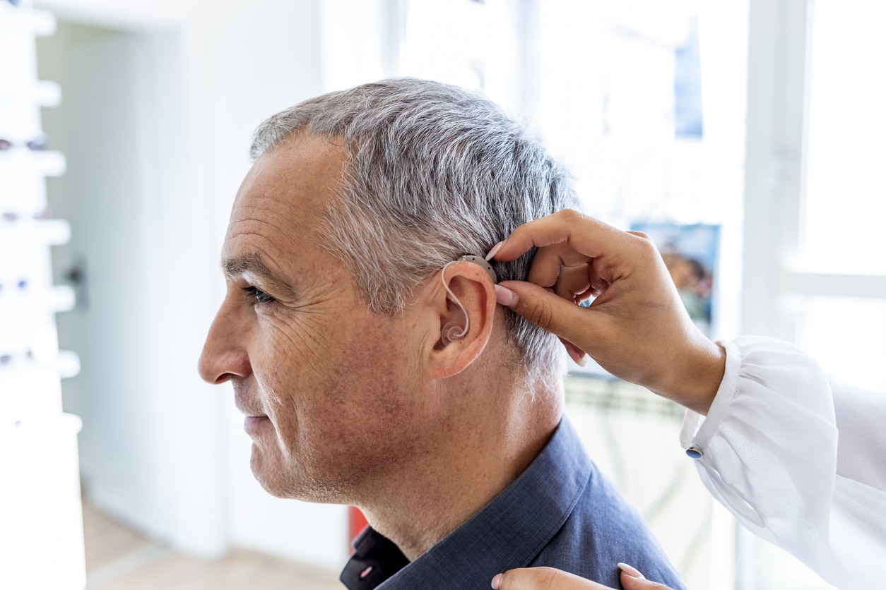 Man sees hearing specialist for hearing aid